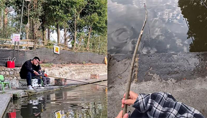 儿子用树枝钓上鱼直喊“爸爸”
