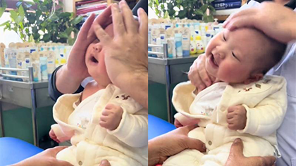 3个月宝宝医院按摩表情享受